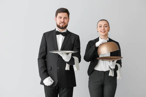 Male Female Waiters Grey Background — Stock Photo, Image