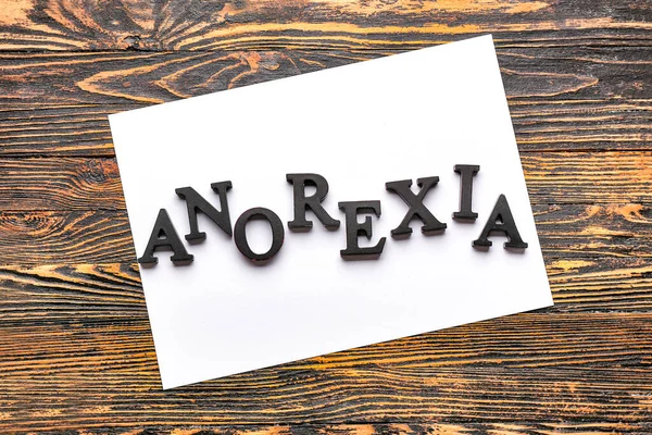 Word Anorexia Paper Sheet Wooden Background — Stock Photo, Image