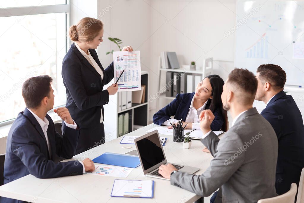 Businesswoman giving presentation in office