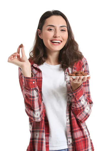 Mooie Jonge Vrouw Eten Smakelijke Chocolade Snoepjes Witte Achtergrond — Stockfoto