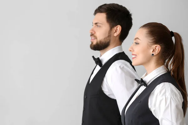 Male Female Waiters Grey Background — Stock Photo, Image