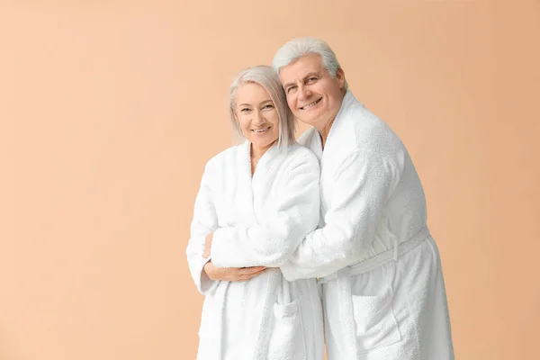 Mature Couple Bathrobes Color Background — Stock Photo, Image