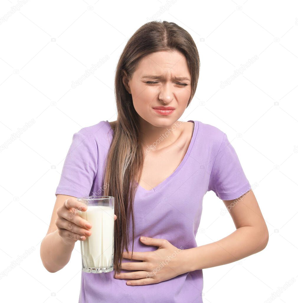 Young woman with milk allergy on white background