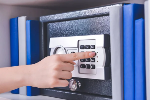 Woman Opening Modern Safe Indoors — Stock Photo, Image