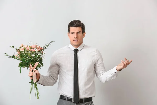 Handsome Confused Man Bouquet Flowers Light Background — Stock Photo, Image