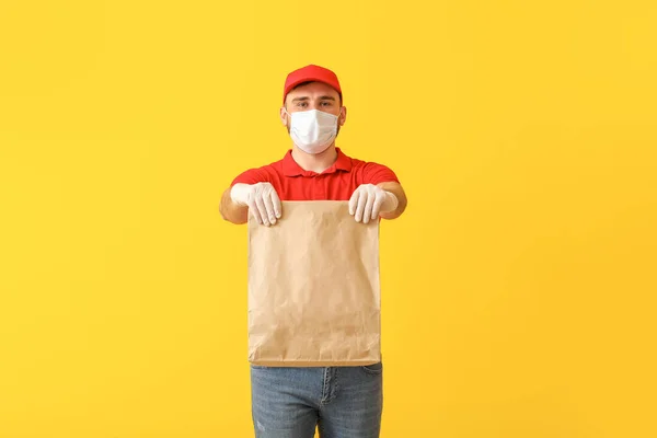 Male Courier Food Delivery Company Medical Mask Color Background — Stock Photo, Image