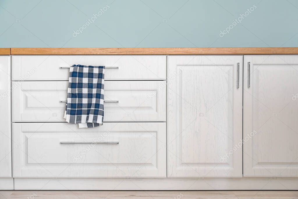 New furniture with towel in modern kitchen