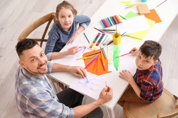 Drawing teacher giving private lessons at home