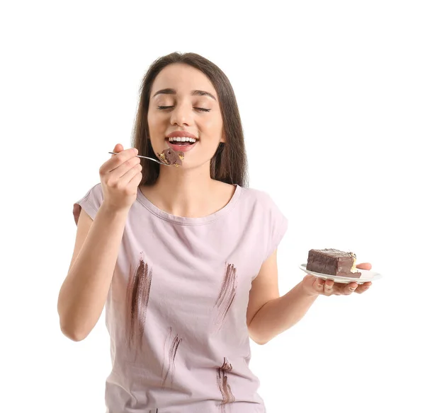 Young Woman Dirty Clothes Eating Chocolate Cake White Background — Stock Photo, Image