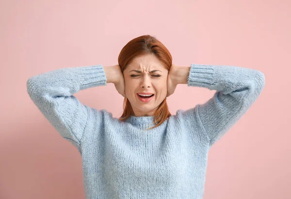 Young Woman Suffering Loud Noise Color Background — Stock Photo, Image