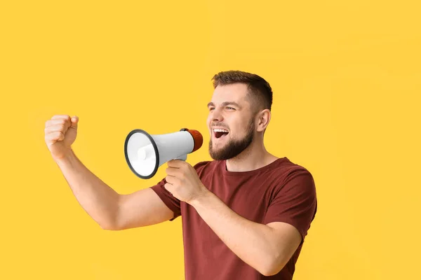 Emotional Young Man Megaphone Color Background — Stock Photo, Image
