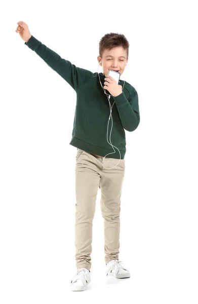 Schattig Jongetje Dansen Luisteren Naar Muziek Tegen Witte Achtergrond — Stockfoto