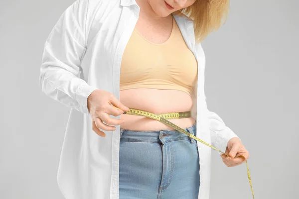 Overweight Woman Measuring Tape Grey Background Closeup Weight Loss Concept — Stock Photo, Image