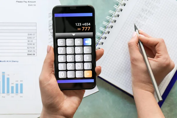 Woman Using Calculator Mobile Application Top View — Stock Photo, Image