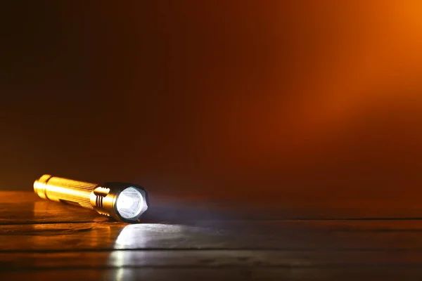 Glowing Modern Flashlight Wooden Table — Stock Photo, Image