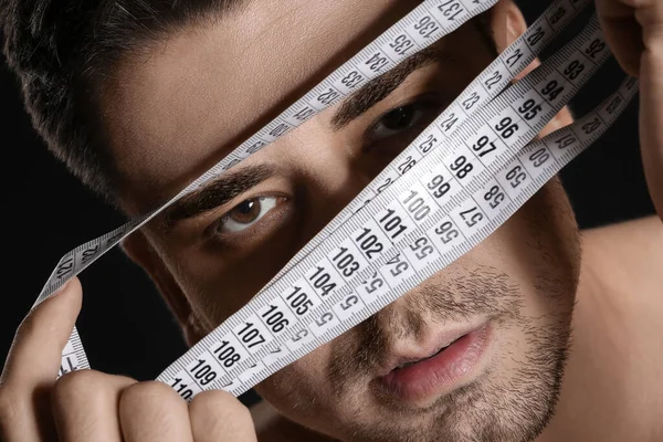 Sick Man Measuring Tape Dark Background Closeup Concept Anorexia — Stock Photo, Image