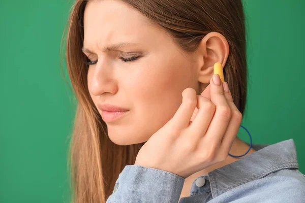 Young Woman Ear Plugs Color Background — Stock Photo, Image