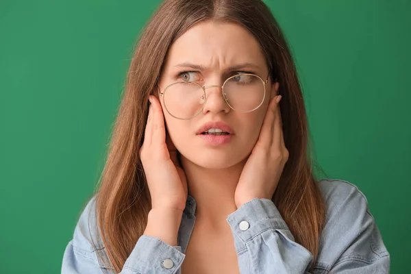 Young Woman Suffering Loud Noise Color Background — Stock Photo, Image