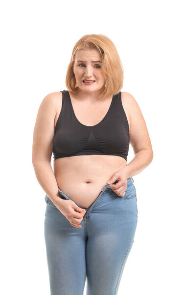 Troubled overweight woman on white background. Weight loss concept
