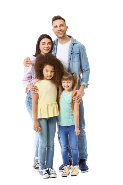 Happy couple with little adopted children on white background