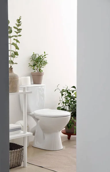 Interior of modern bathroom with floral decor