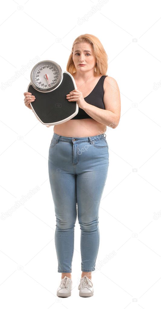 Sad overweight woman with scales on white background. Weight loss concept