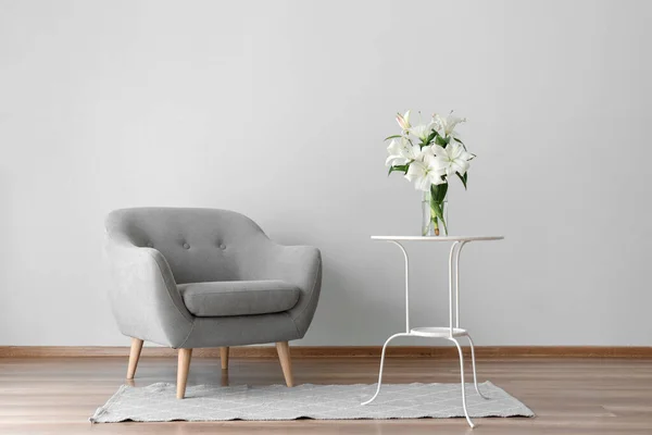 Comfortable Armchair Table Lily Flowers Grey Wall Room — Stock Photo, Image