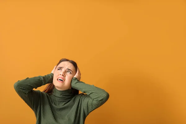 Young Woman Suffering Loud Noise Color Background — Stock Photo, Image