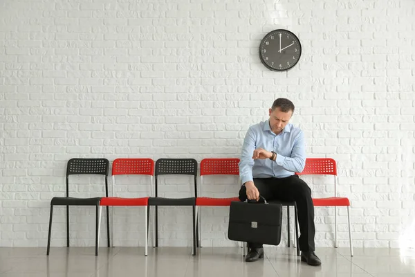 Man Waiting His Turn Indoors — Stock Photo, Image