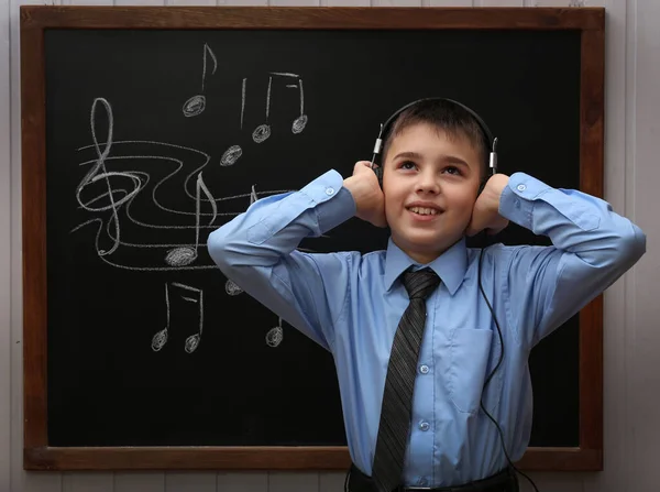 Young Cute Schoolboy Wearing Headphones Blackboard Musical Notes — Stock Photo, Image