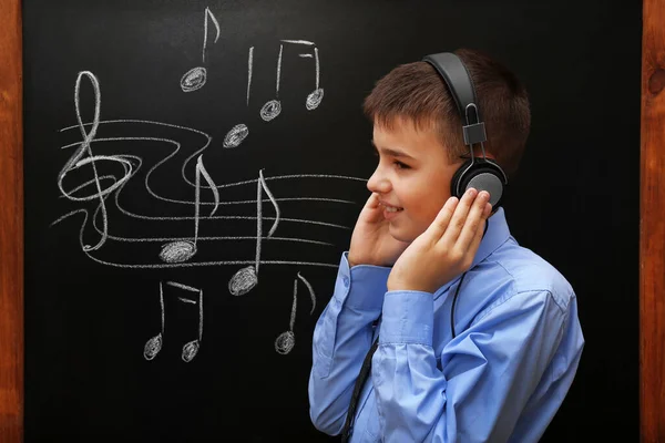 Young Cute Schoolboy Wearing Headphones Blackboard Musical Notes — Stock Photo, Image