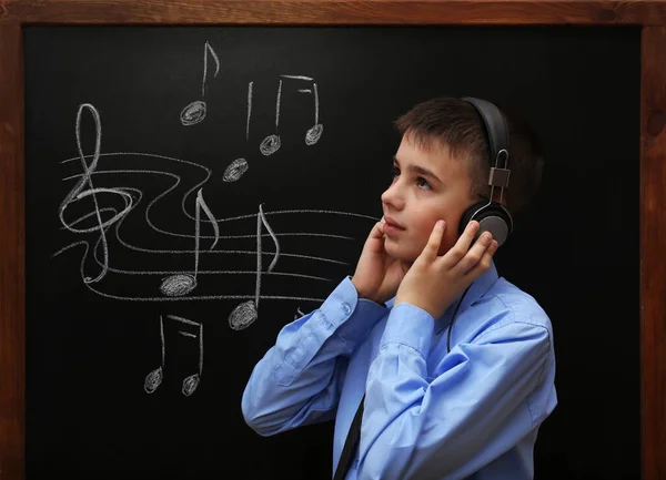 Young Cute Schoolboy Wearing Headphones Blackboard Musical Notes — Stock Photo, Image