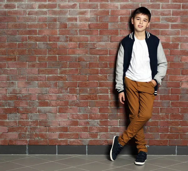 Cute Little Boy Standing Brick Wall — Stock Photo, Image