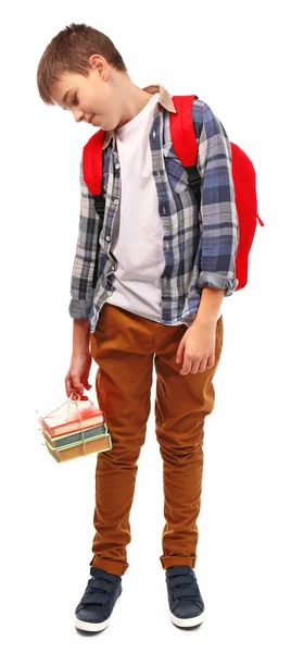 赤のバックパックと本の束を持つ疲れた少年は 白い上に隔離された — ストック写真