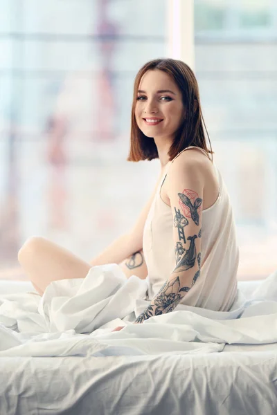 Attractive Woman Tattoo Sitting Bed — Stock Photo, Image