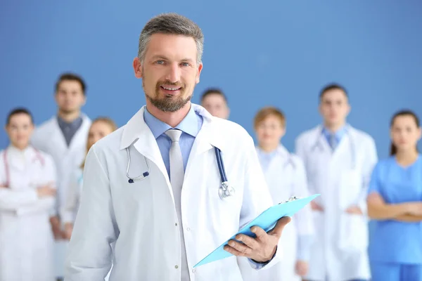 Male doctor with medical team in hospital