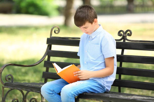 Cute Boy Reading Book Bench — Stock Photo, Image