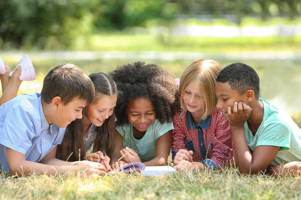 Cute Kids Reading Book Green Grass — Stock Photo, Image