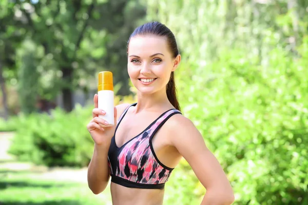 Sporty Woman Holding Sunscreen Blurred Nature Background — Stock Photo, Image