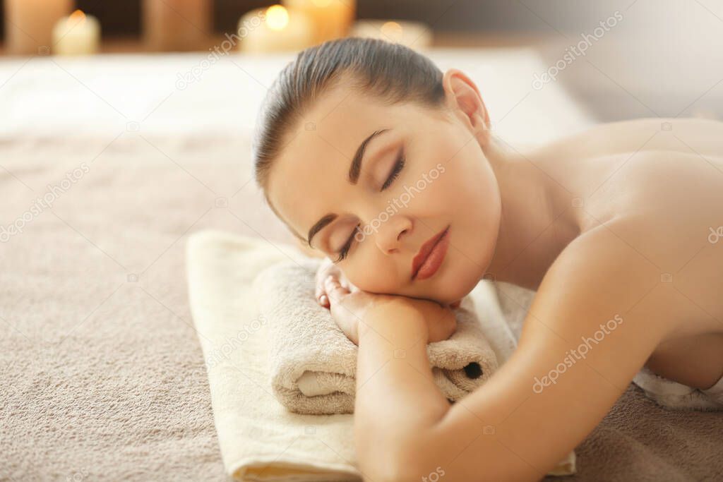 Attractive woman waiting for rejuvenation procedure in spa salon