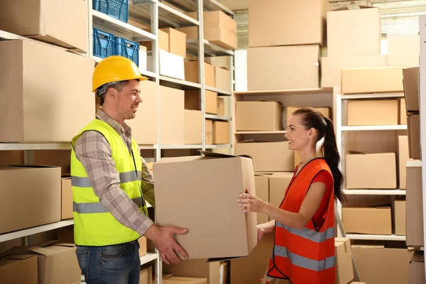 Young business people working at warehouse