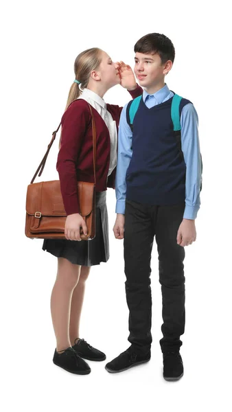 穿着校服站在白色背景上的可爱男孩和女孩 — 图库照片