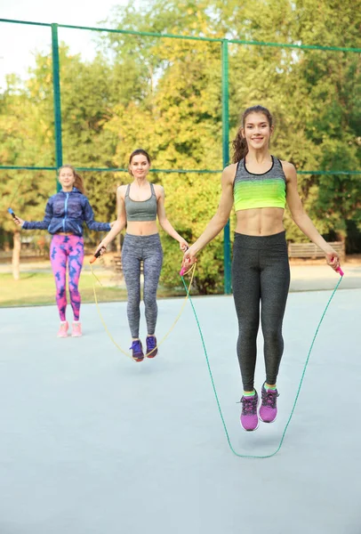 Young Sporty People Jumping Rope Outdoors — Stock Photo, Image