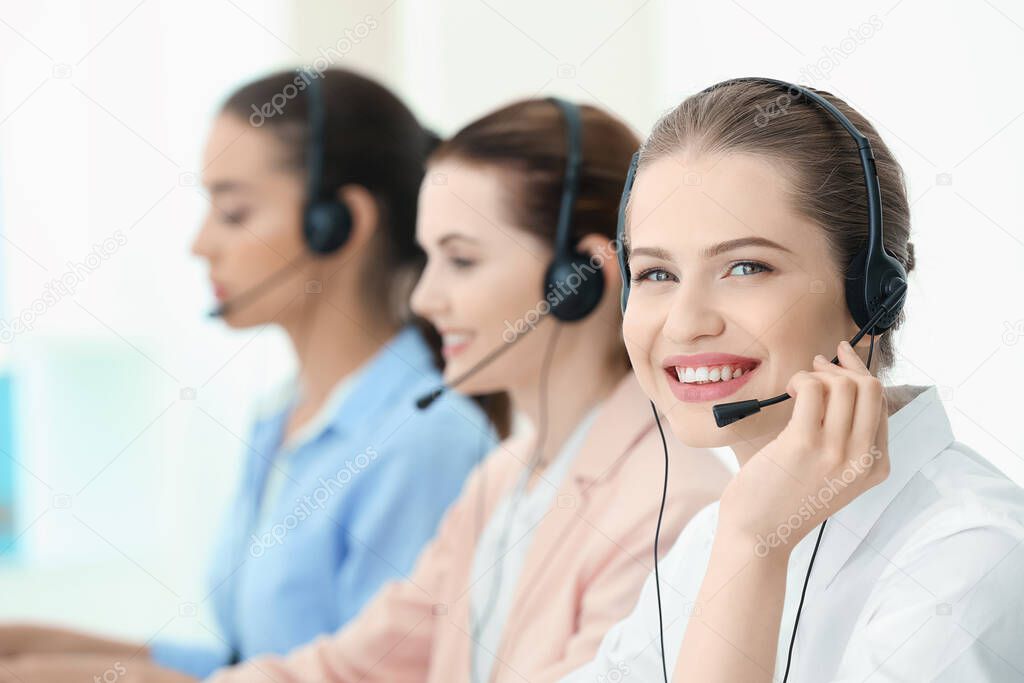 Young female technical support dispatchers working in office