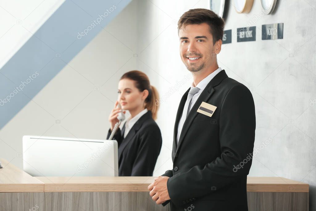 Male receptionist working in hotel