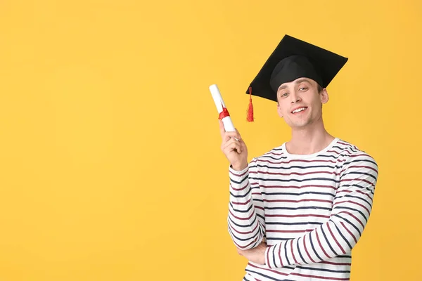 Young Man Graduation Hat Diploma Color Background — Stock Photo, Image