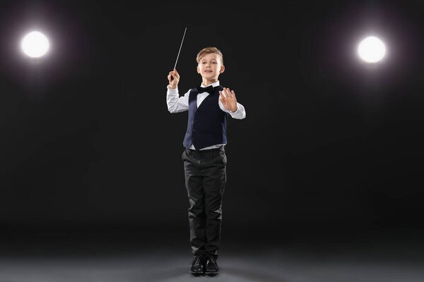 Little conductor on dark background