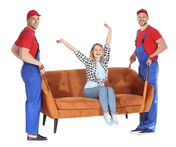 Loaders carrying furniture against white background