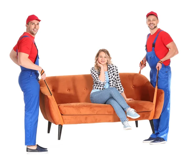 Loaders carrying furniture against white background