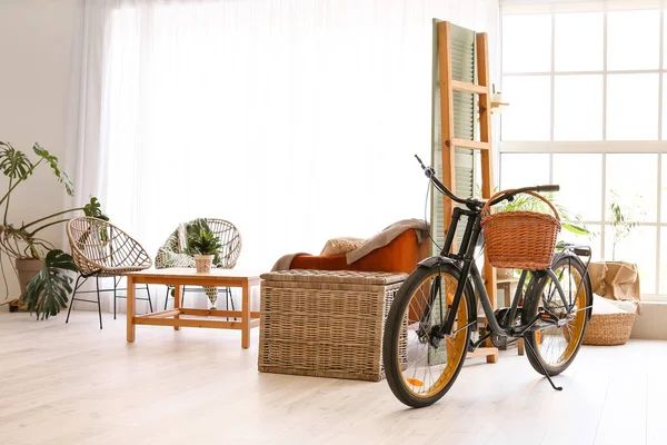 Interior of modern studio apartment with bicycle